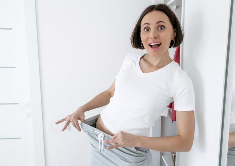 Woman celebrating her weight loss transformation