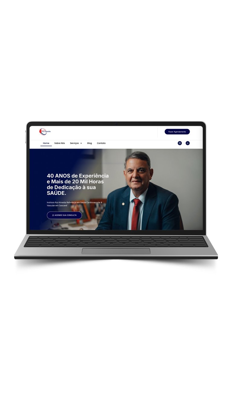 Laptop displaying a healthcare website in Portuguese featuring a professional man in business attire and text about 40 years of experience