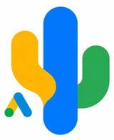 Abstract colorful shapes: a blue vertical rectangle, yellow curved shape, green oval, and small geometric elements