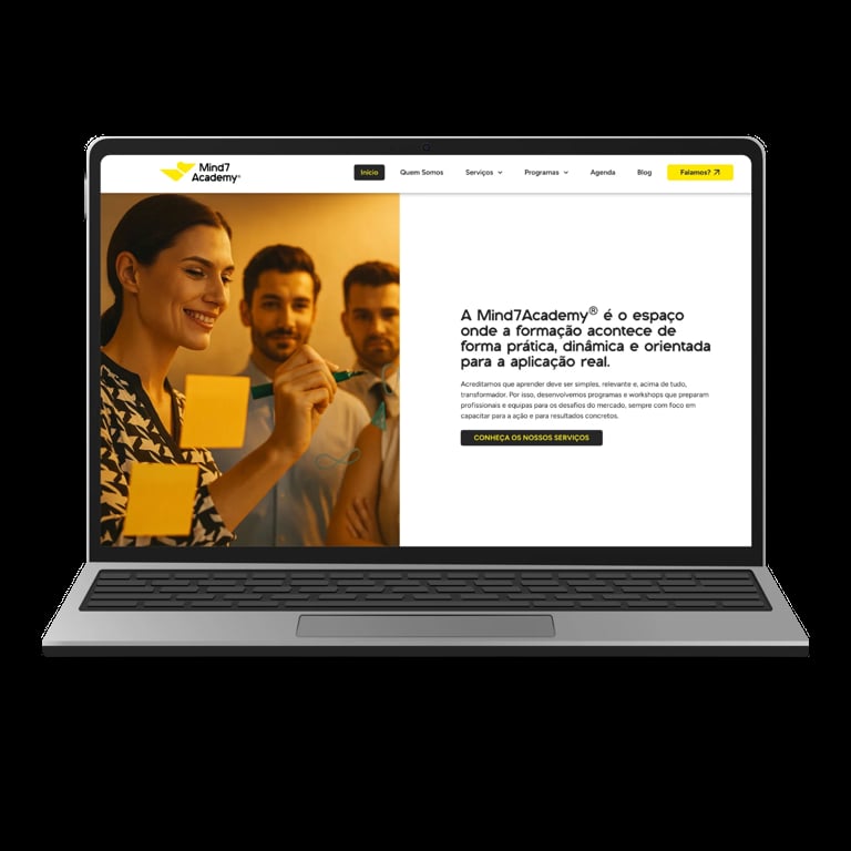 Laptop displaying Mind Academy website with three smiling professionals and Portuguese text about online education courses